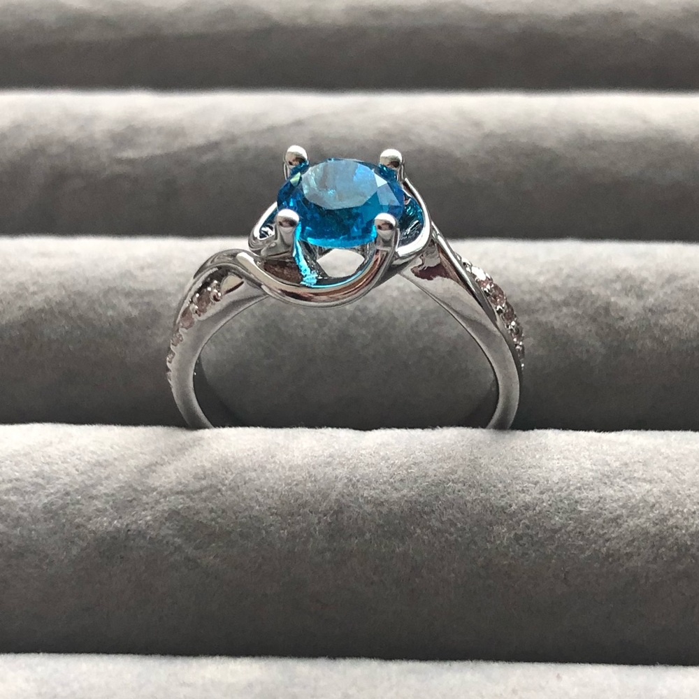 COPY - Blue Topaz Ring w/rhodium plated silver ba…